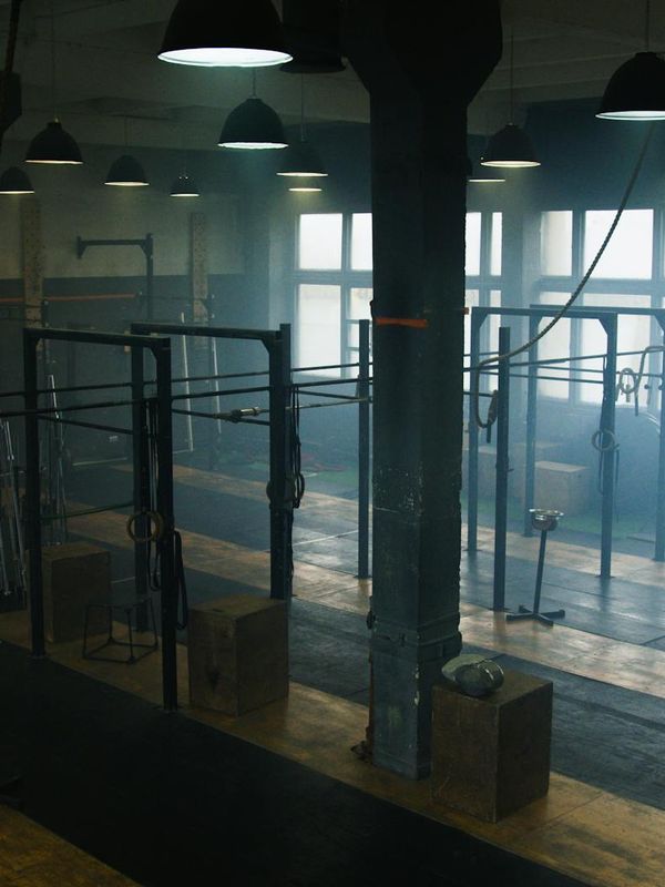 Bright and spacious room with a yoga mat on the floor.